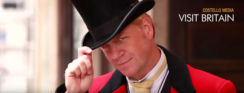 Uniformed Maitre d tips his top hat